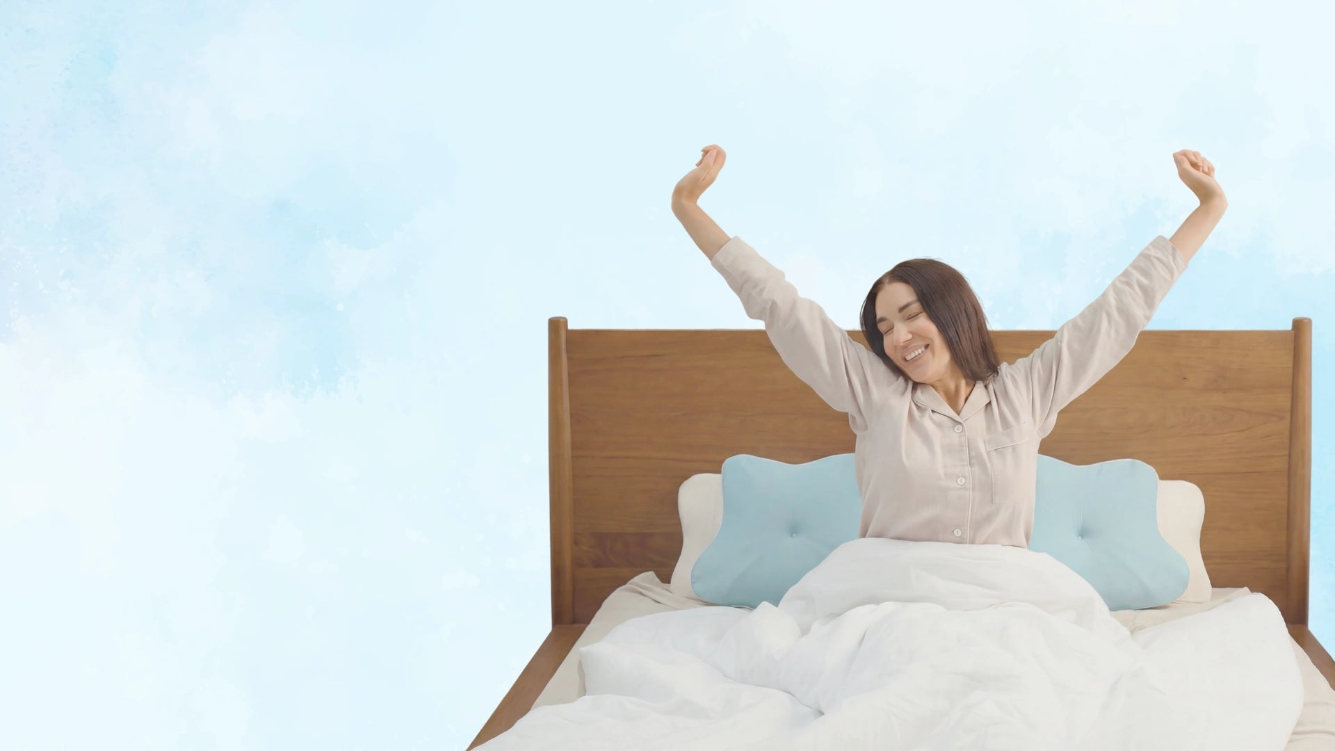 Woman waking up refreshed and well-rested after sleeping on Sleepsake pillows