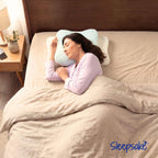 Woman using a Sleepsake pillow in bed